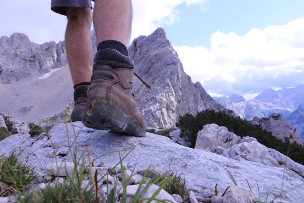 istock Hiking over rocks on a mountain trail 1166859583