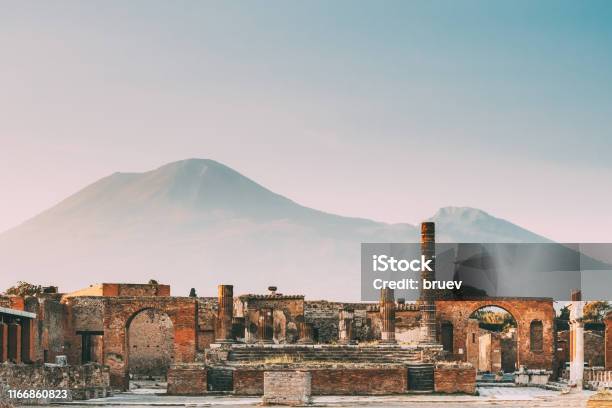 Pompeii Italy Temple Of Jupiter Or Capitolium Or Temple Of Capitoline Triad On Background Of Mount Vesuvius Stock Photo - Download Image Now