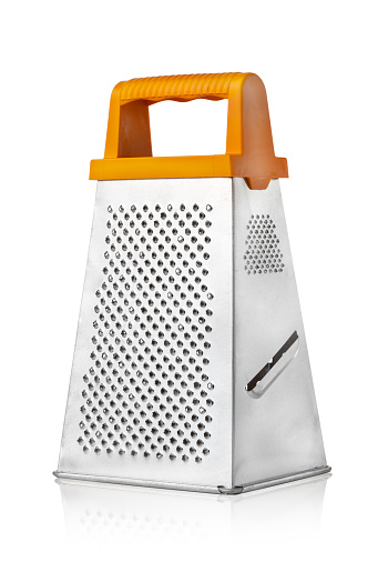 Grater For Vegetables On A White Background Kitchen Grater Closeup