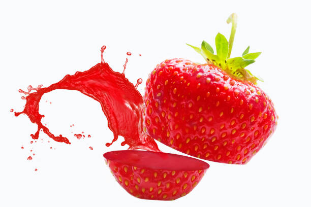istock Strawberry sliced with splashing juice on a white background 1166862783