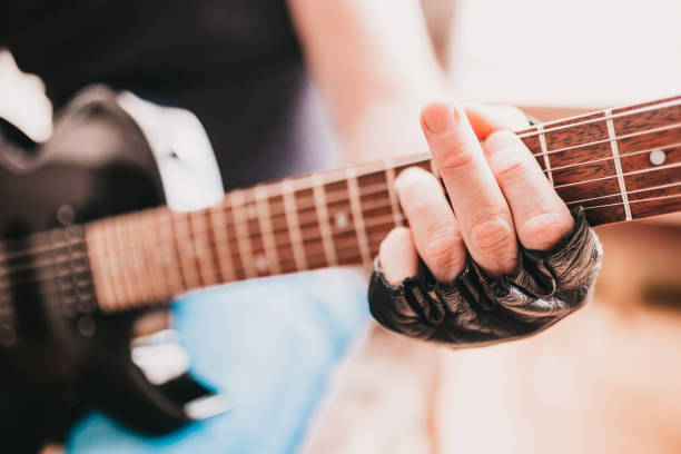 Close up of a man playing electric guitar