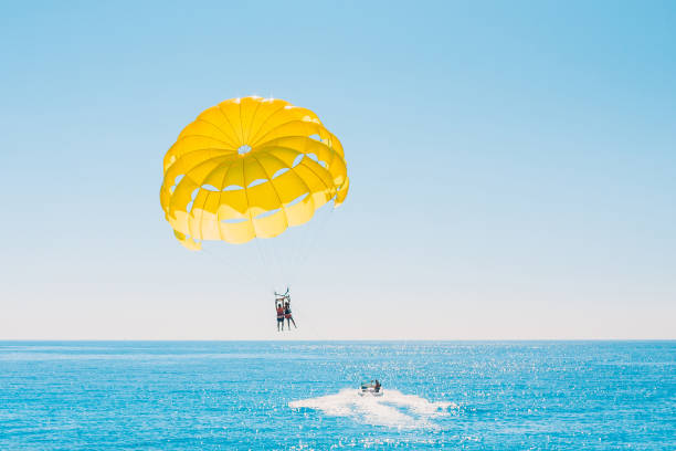 Delight of people from parasailing flight - incredible impressions of the freedom of soaring and amazing view from the height Delight of people from parasailing flight - incredible impressions of the freedom of soaring and amazing view from the height parasailing stock pictures, royalty-free photos & images
