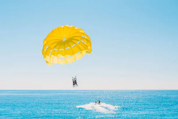 Photo of Delight of people from parasailing flight - incredible impressions of the freedom of soaring and amazing view from the height