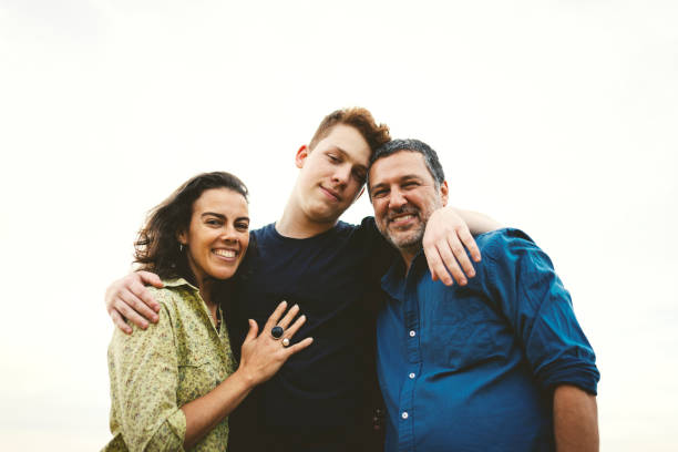 istock Family together outdoors smiling and having fun 1166866374