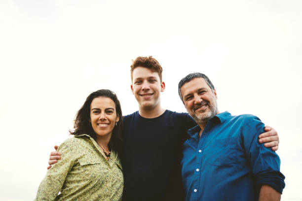 istock Family together outdoors smiling and having fun 1166866772