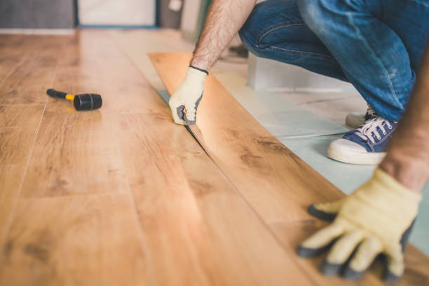istock Closeup of master laying laminate flooring 1166866795