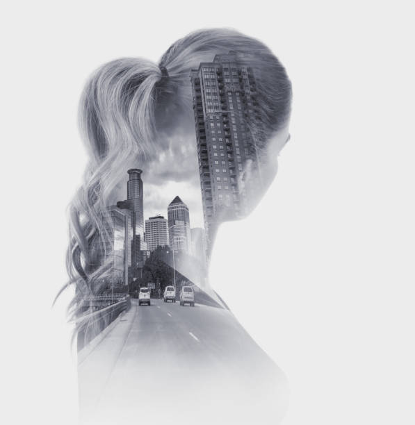 istock Multiple exposure of a woman, highway exit and cityscape 1166866894