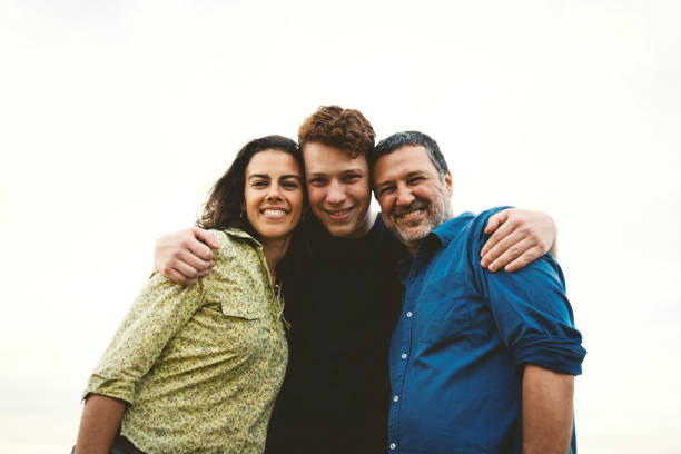 istock Family together outdoors smiling and having fun 1166867046