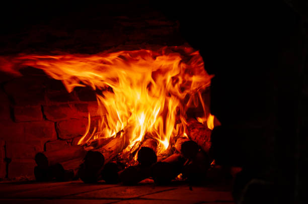 istock Image of a brick pizza oven with fire. Fire in the oven 1166867613