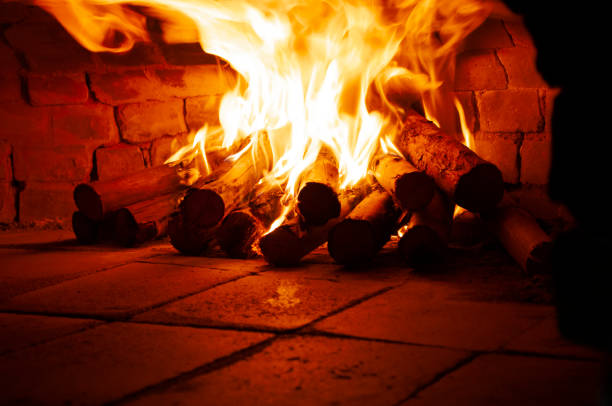 Image of a brick pizza oven with fire. Fire in the oven