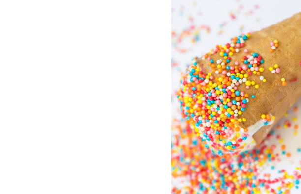 Banner Ice cream in a cone covered with bright sprinkling close-up