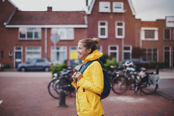 istock Smiling student walking at the street 1166870162