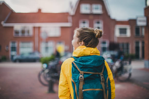 smiling student walking at the street - dutch ethnicity imagens e fotografias de stock