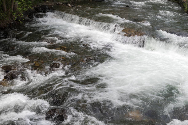 istock Mountain river stream of water between mountain stones. 1166870189