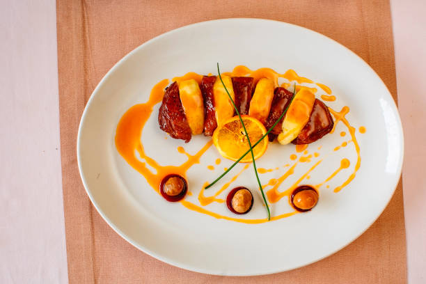 istock Baked duck breast with peach and sauce 1166870339