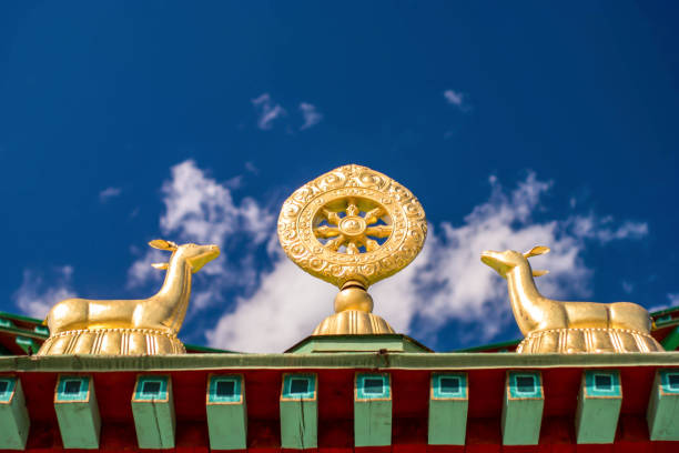 istock Dharma Wheel and Pair of Deer 1166872716