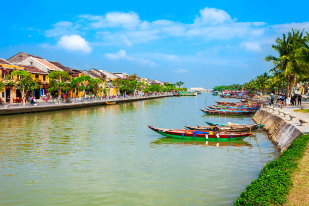 Hoi An ancient town riverfront Fishing boats at the riverfront of Hoi An ancient town in Quang Nam Province of Vietnam dong stock pictures, royalty-free photos & images