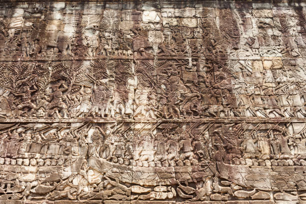 Close-up of the ancient stone face carvings at Angkor Wat in Siem Reap, Cambodia, highlighting intricate details and historical significance.