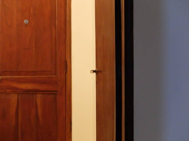 istock closed and open wooden doors 1166879393