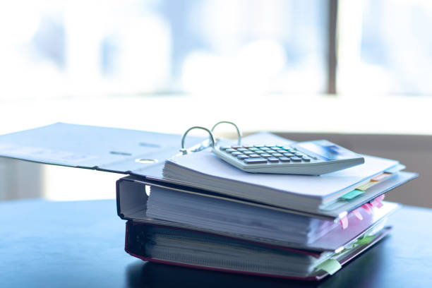 istock Workplace with notebook, pen and calculator on the desk. 1166879565