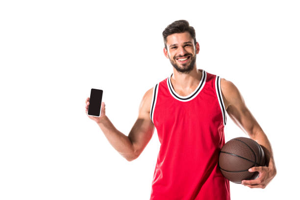 istock basketball player holding smartphone with blank screen Isolated On White 1166881432