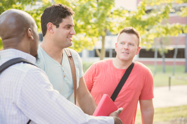 istock College student friends talk together on university campus. 1166881661