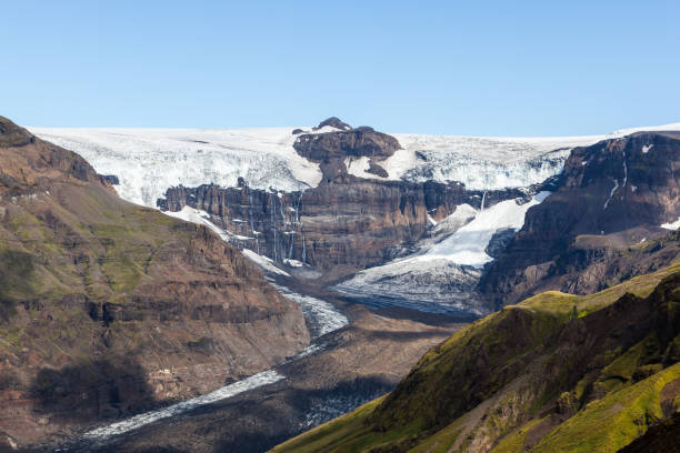 istock Skaftafellsjokull glacial river going down the volcano mountain. 1166881717