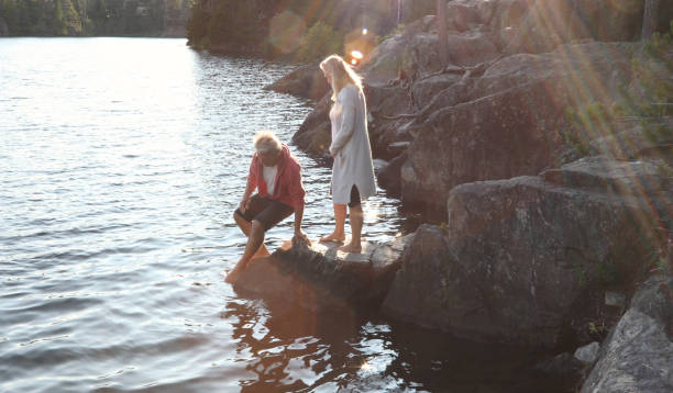 istock couple rock helping hand 1166882768