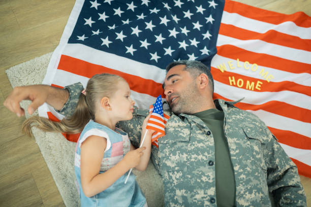 istock Military servant feeling touching talking to his little daughter 1166882818