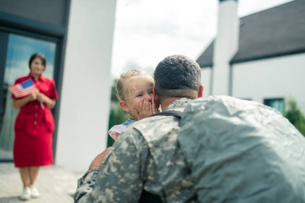 istock Daughter crying because of happiness while seeing daddy back home 1166882930