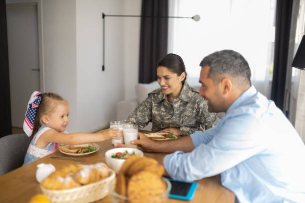 istock Happy beaming family having breakfast all together 1166883143