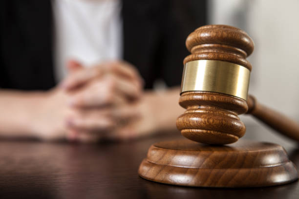 istock Gavel with woman hand 1166884654