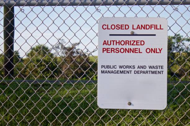 istock Closed Landfill sign on chain link fence 1166884693