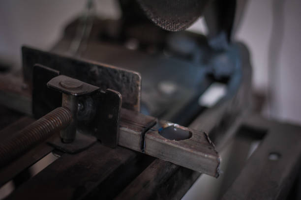 istock Cutting metal with grinder in workshop. Sparks while grinding iron. Cutting machine. 1166885835