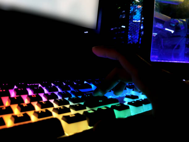 istock rainbow colorful rgb battle station rendering gaming pc led case and mechanical keyboard 1166891155