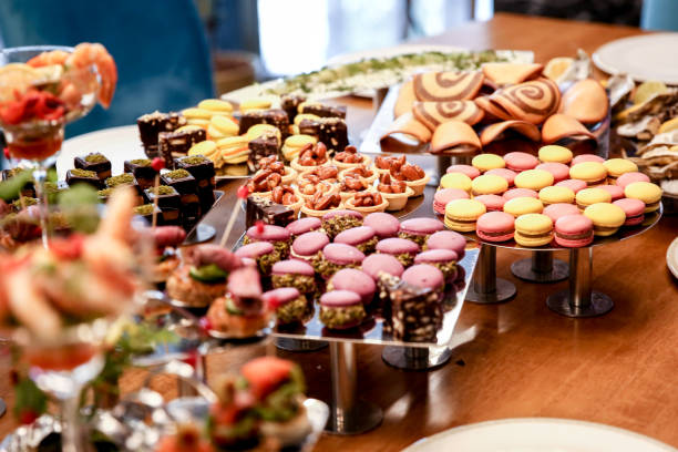 istock blue chairs long fancy table fulfilled with candies and desserts 1166891280