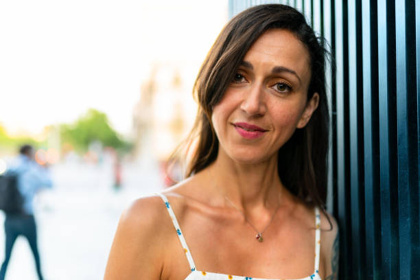 istock Beautiful woman leaning on metallic wall 1166891373