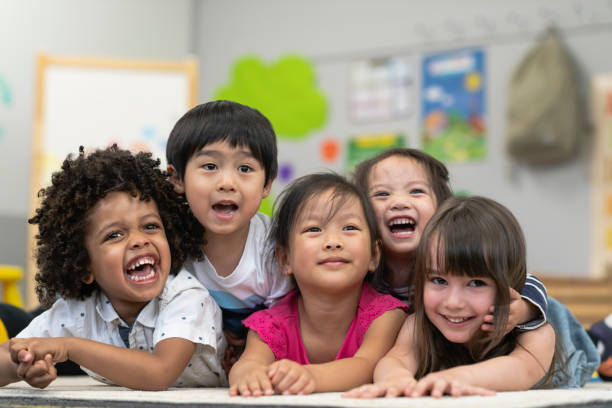 istock Group of smiling preschool students 1166891662