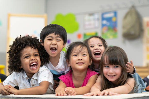 istock Group of smiling preschool students 1166891670