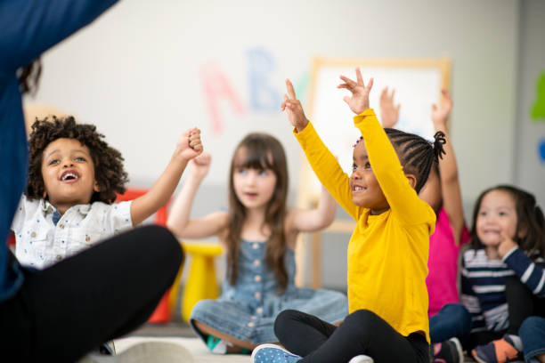 istock Multi-ethnic group of preschool students in class 1166892019