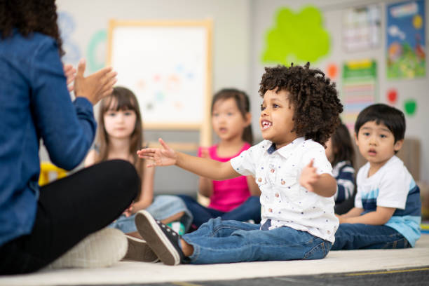 istock Multi-ethnic group of preschool students in class 1166892030