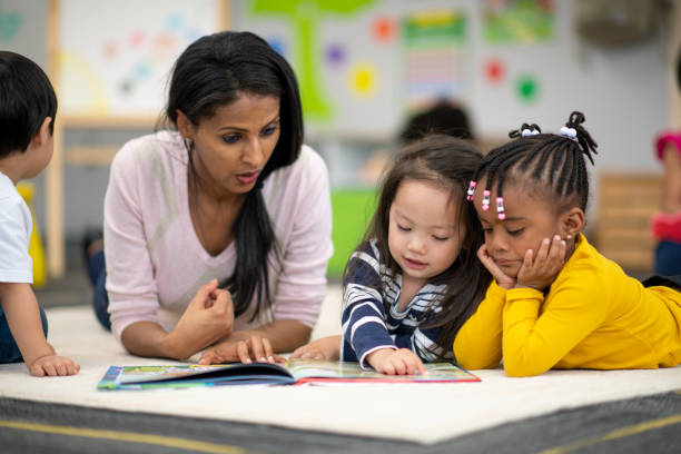 istock Preschool teacher reading with students 1166892040