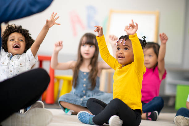 istock Multi-ethnic group of preschool students in class 1166892599