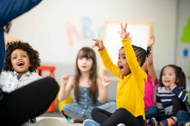 istock Multi-ethnic group of preschool students in class 1166892729