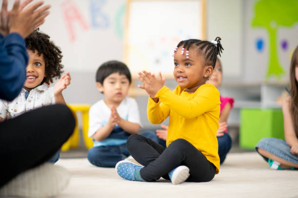 istock Multi-ethnic group of preschool students in class 1166892774