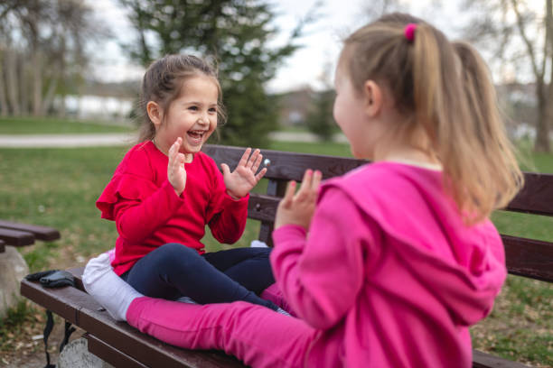 istock Playful children playing on a park bench 1166893143