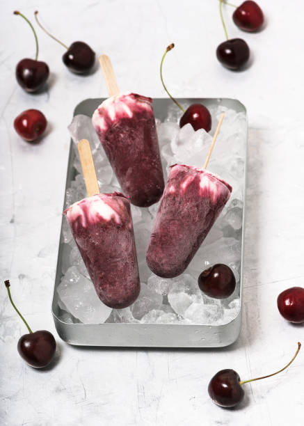 istock Homemade popsicles from cherry and yogurt with fresh berries. 1166893189