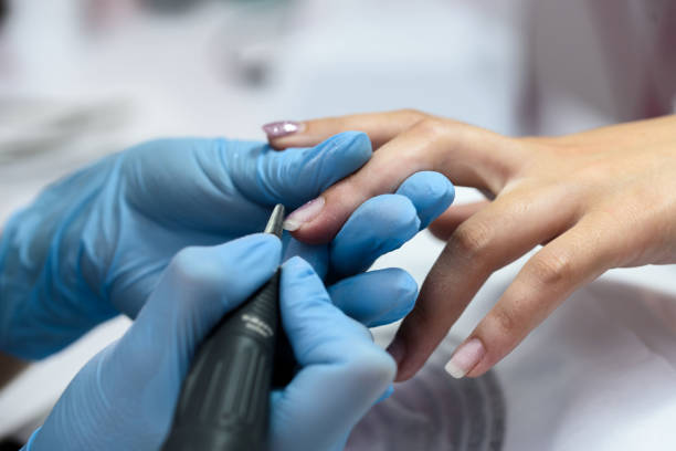 istock Female hands at work of manicure, work of the master. 1166893487