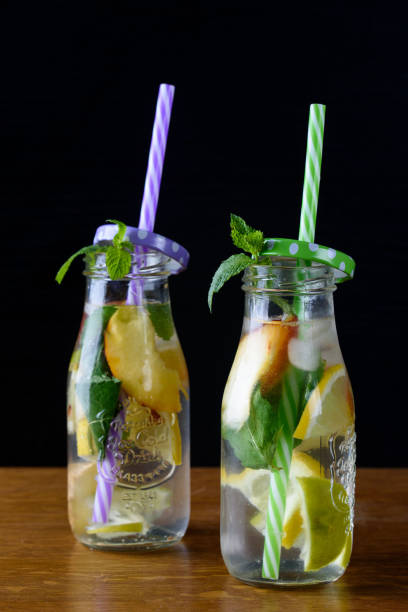 istock A cool drink with fresh fruit and ice. Peppermint, peach, lemon, lime. 1166893508