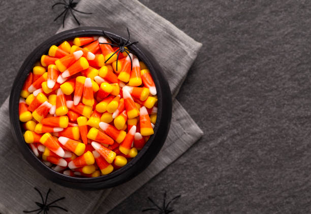 istock Halloween Bowl of Candy Corn with Spiders Copy Space 1166893556